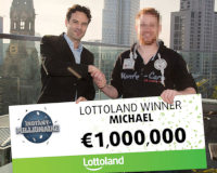 German scratchcard winner Michael collects 1 million Euro cheque